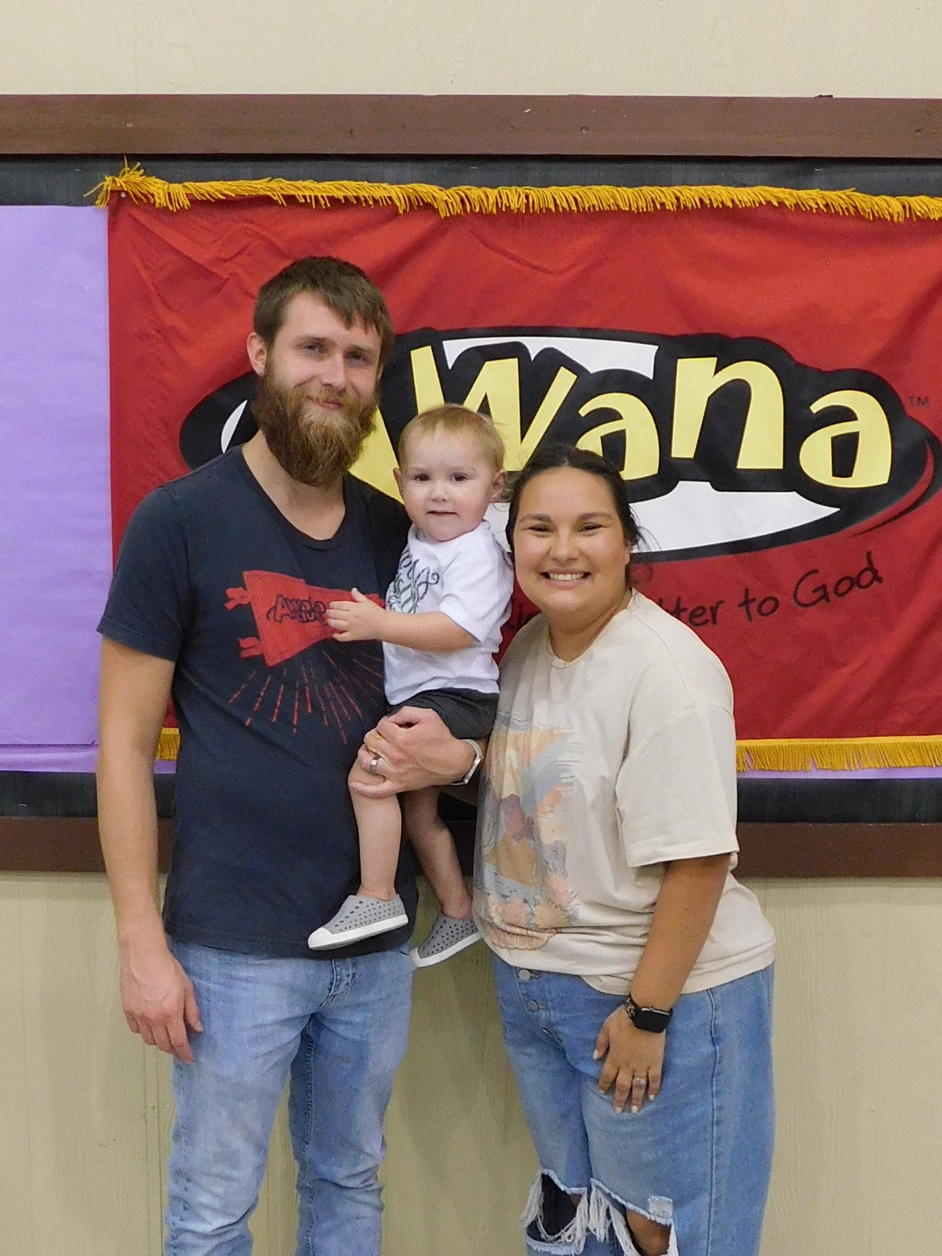 Jake Fluke with his wife, Elizabeth, and their son, Jonah